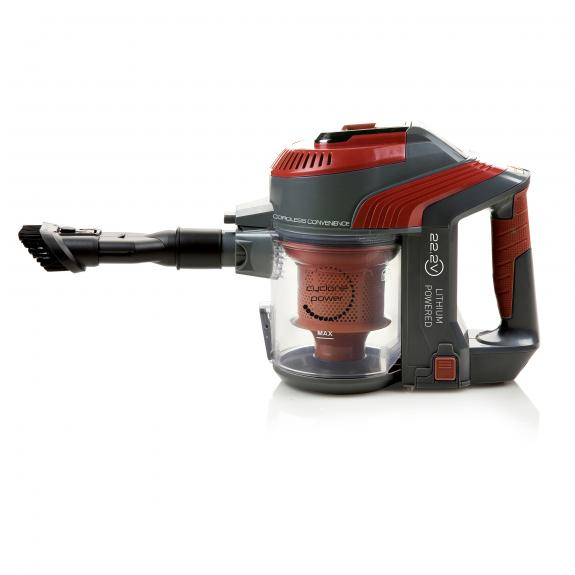 Aspirateur sans fil rouge et gris. Il possède un conteneur à poussière transparent.