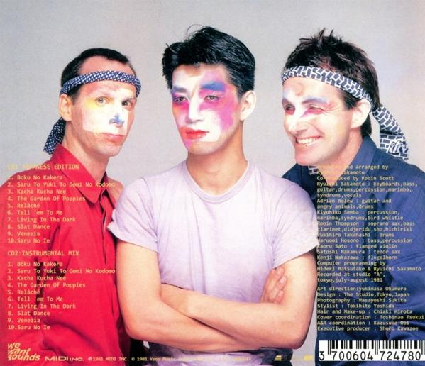 Drei Männer mit bemalten Gesichtern auf einem Albumcover, Text auf der Rückseite.