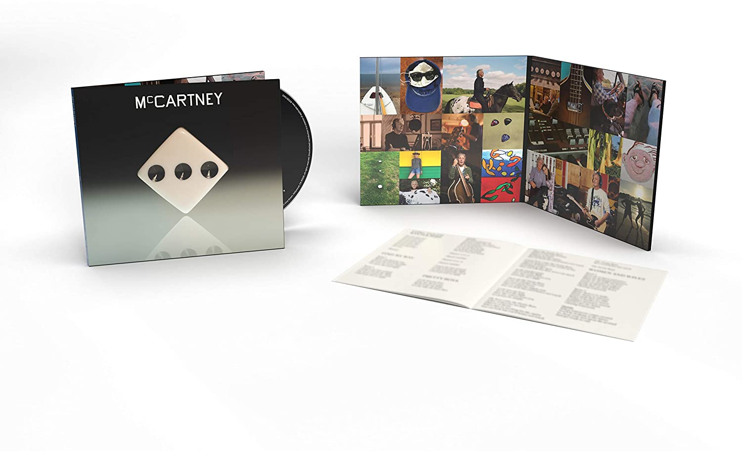 CD album borítóval és füzettel. Fekete borító fehér dizájnnal, kinyitva fotókkal és szövegekkel.