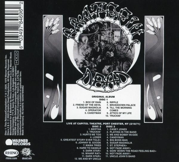 Album achterkant met songtitels, schijfinformatie en credits op een zwarte achtergrond.