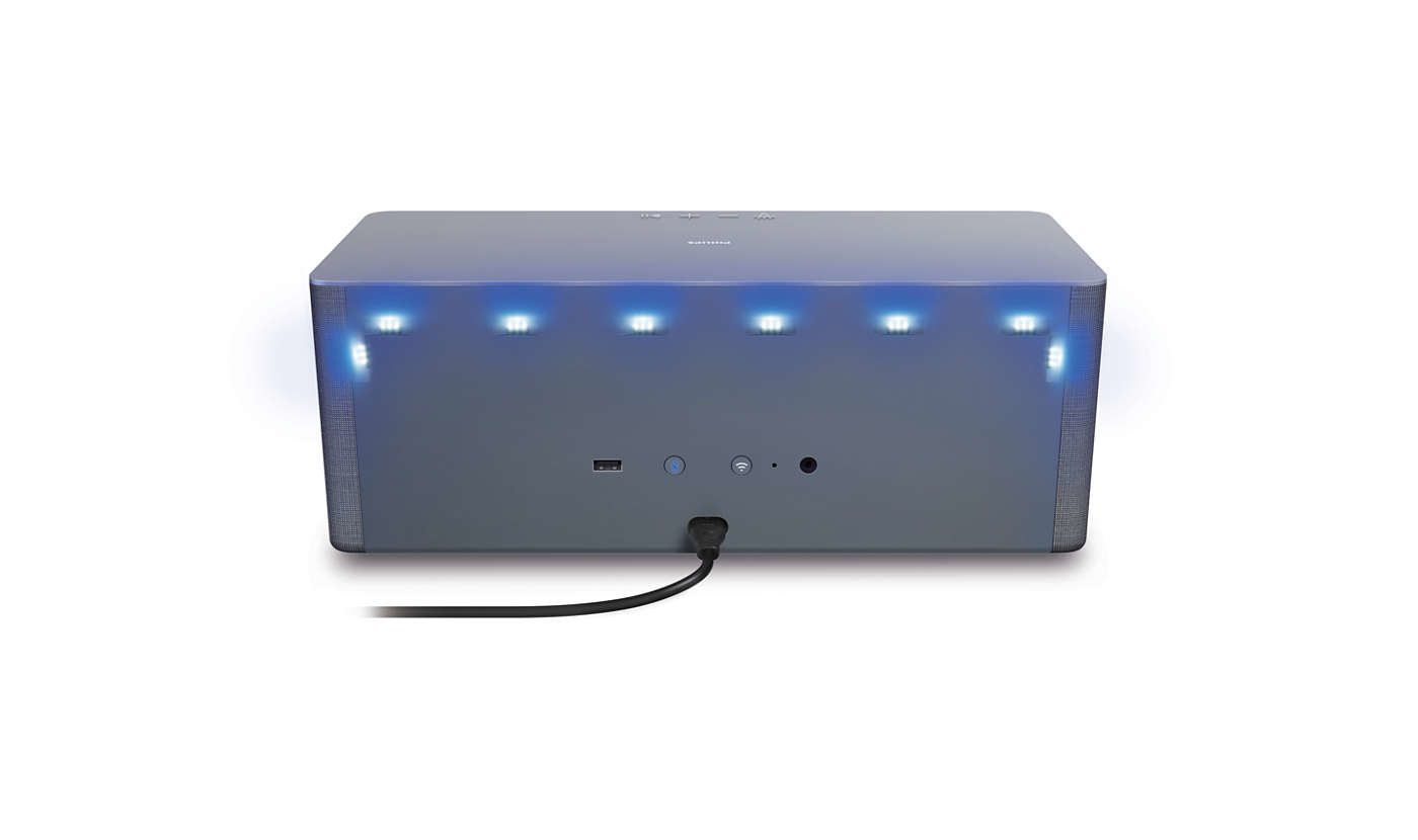 Grauer rechteckiger Lautsprecher mit blauen Lichtern, schwarzes Kabel.