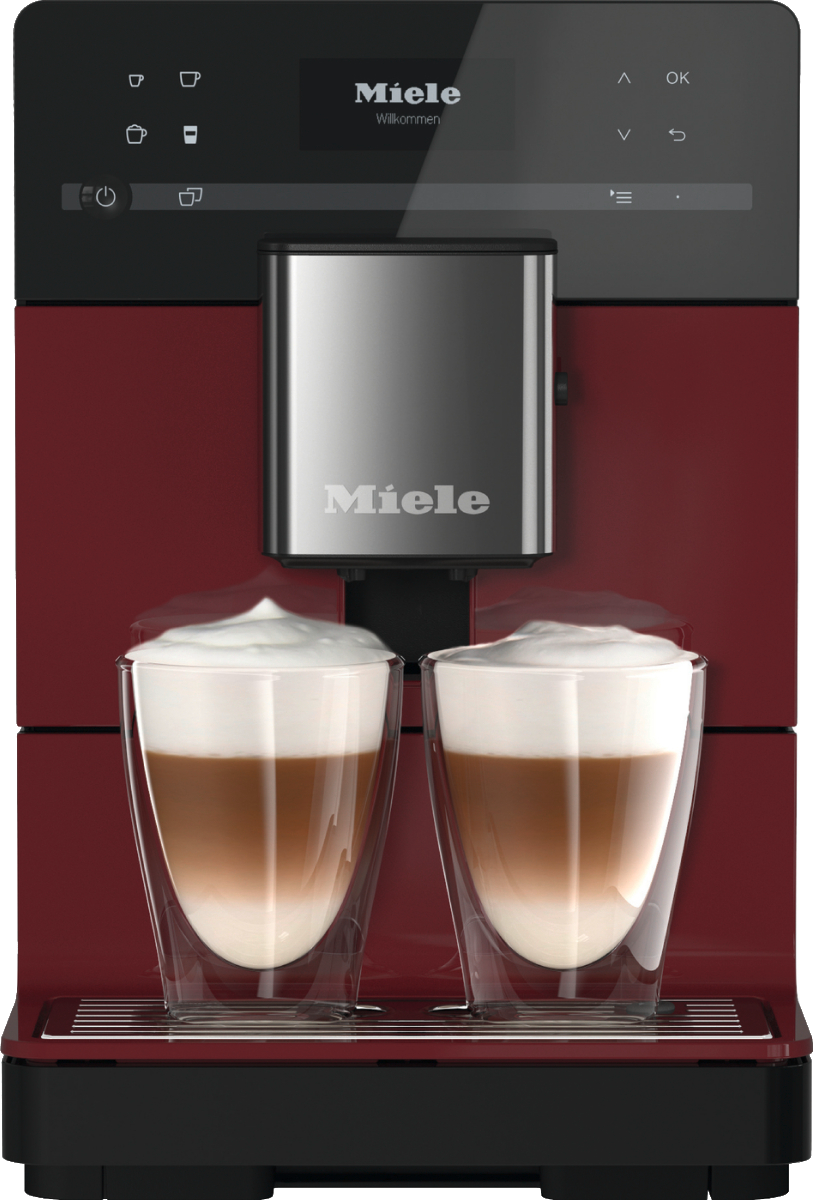 Eine Miele-Kaffeemaschine mit zwei Gläsern geschichteten Kaffees und weißem Schaum.