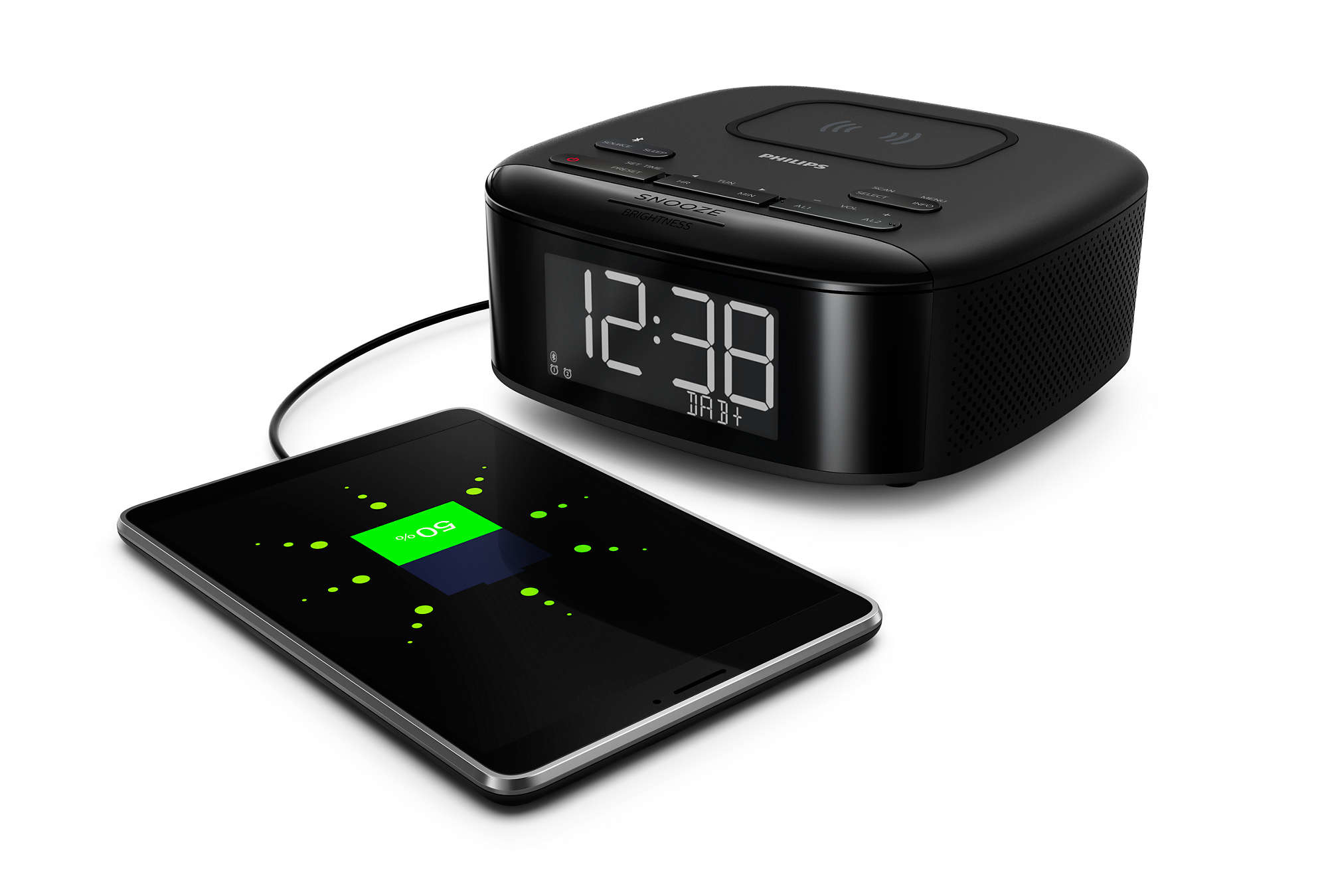 Black alarm clock with a digital display, a charging tablet, and a white background.