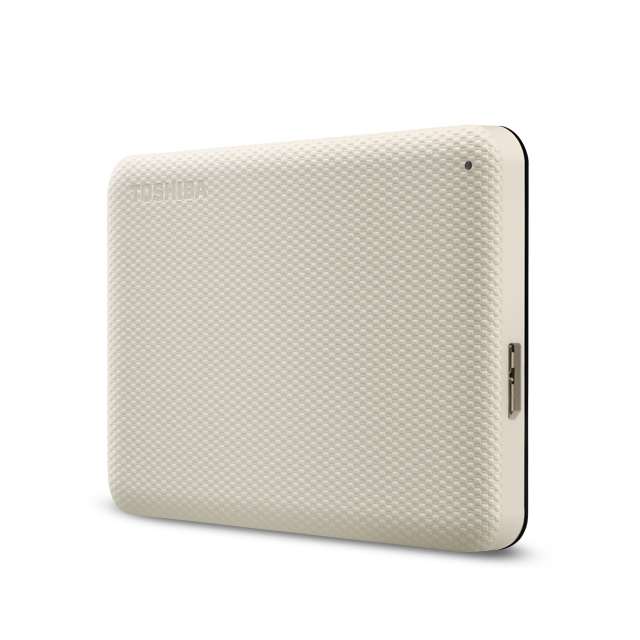 Disco duro externo color crema con superficie texturizada y un pequeño punto negro.