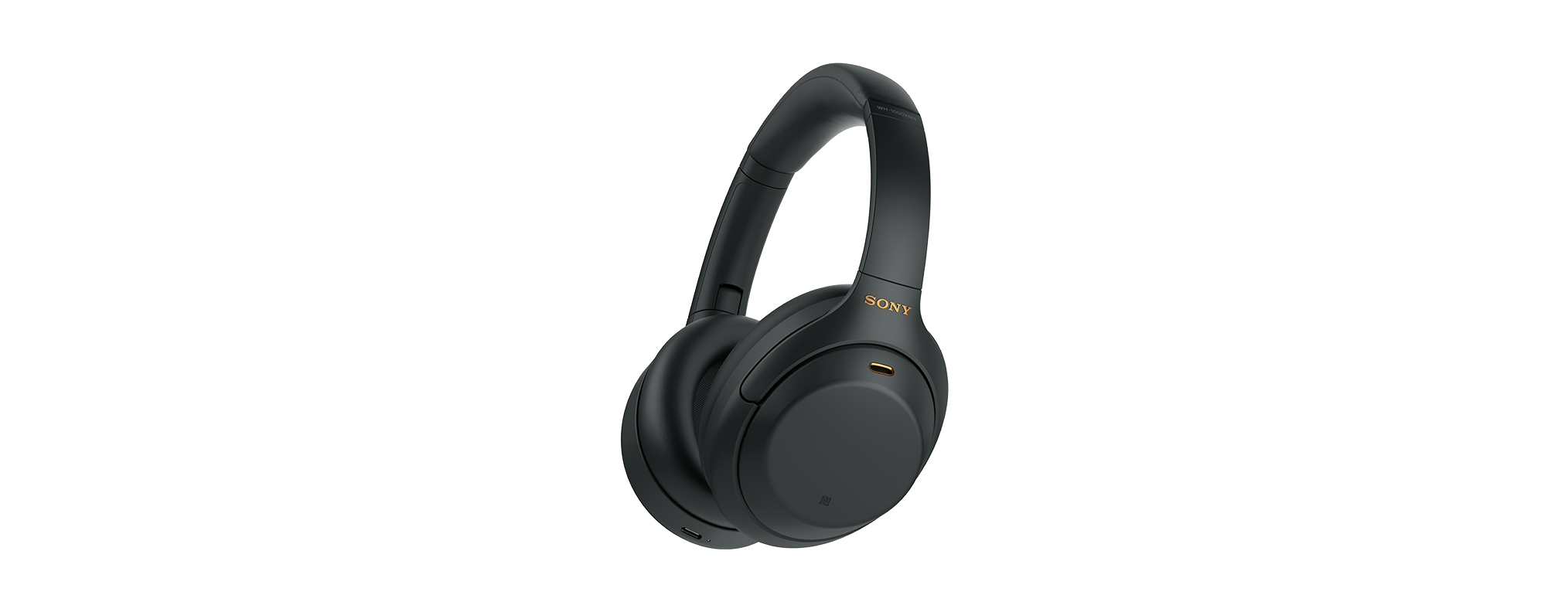 Fekete Sony fejhallgató fekete háttéren. A fejhallgató over-ear stílusú.