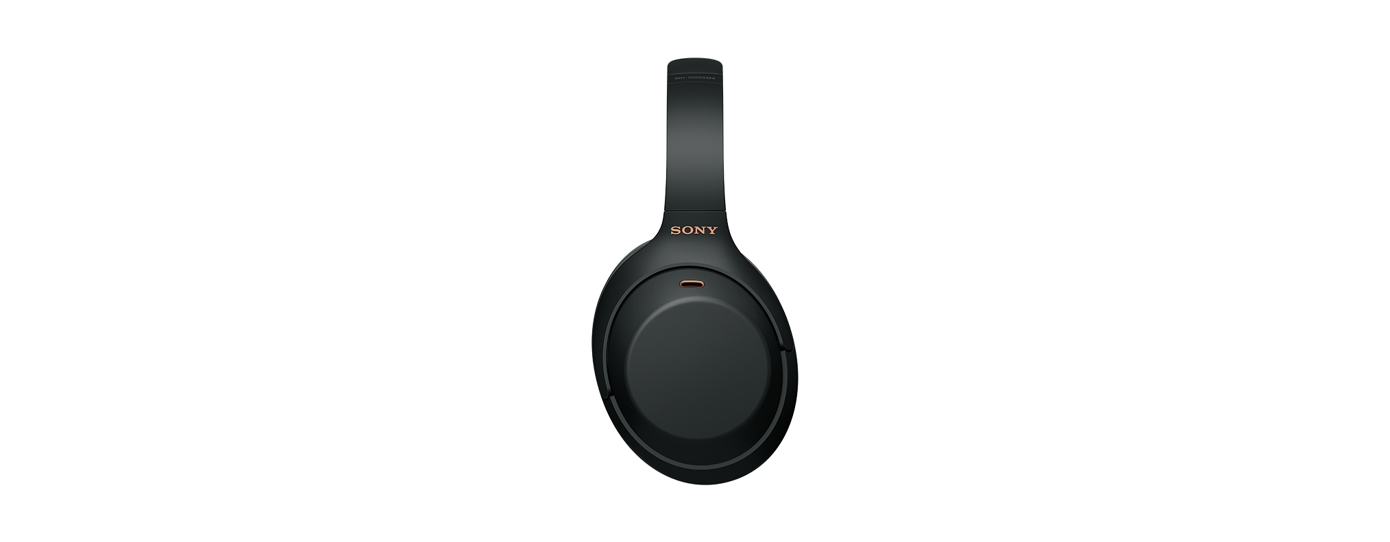 Fekete Sony fejhallgató fekete háttér előtt. A fejpánton arany SONY felirat látható.