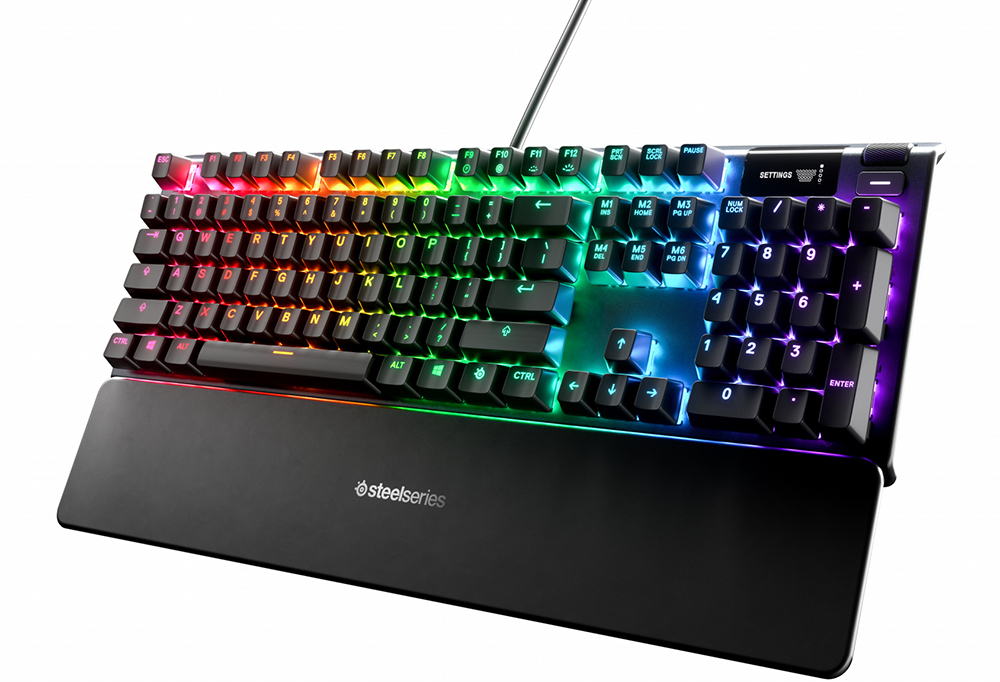 Black SteelSeries keyboard with multicolored lighting and a wrist rest.