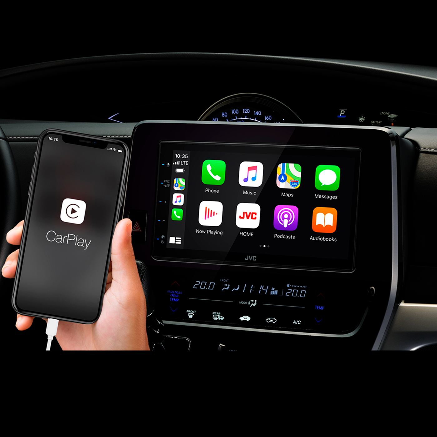 A person is holding a phone, displaying CarPlay, next to car screen.