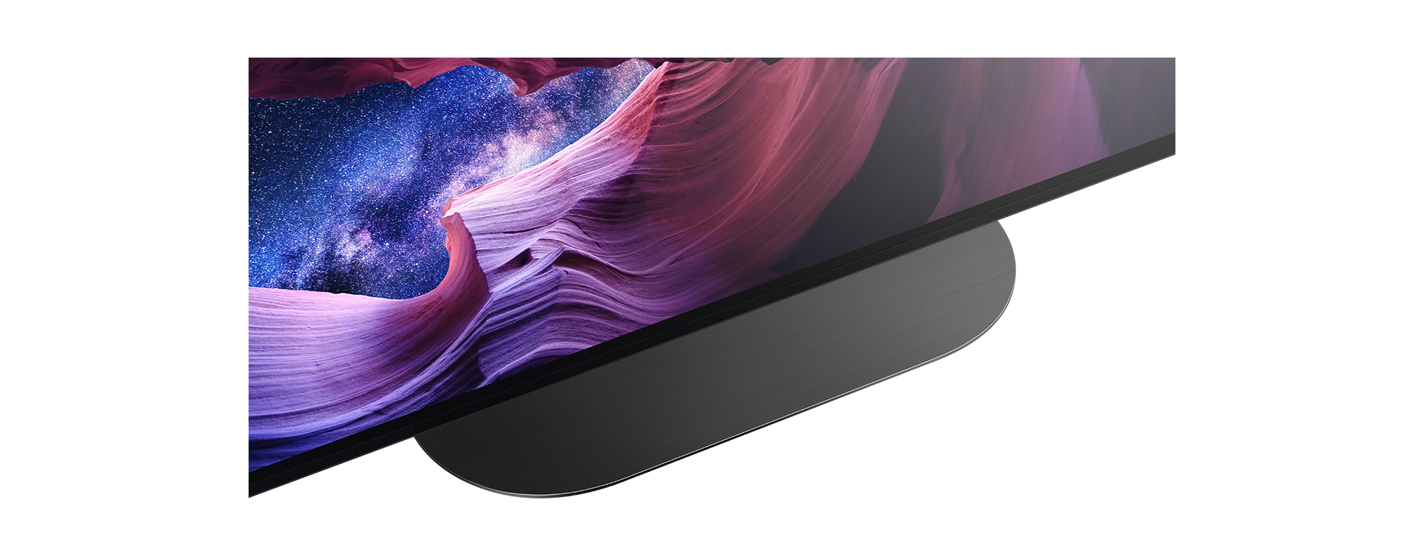 Közeli kép egy TV képernyőről, tájkép látható.