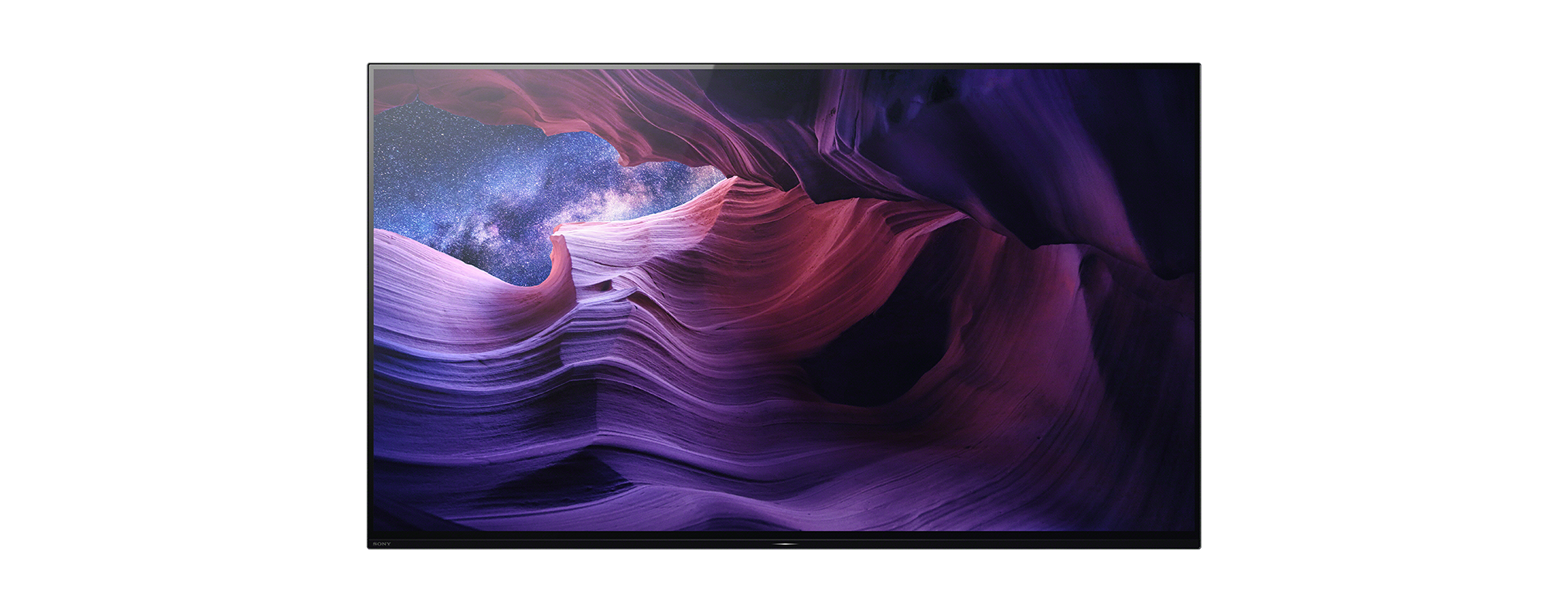 Nagy TV-képernyő, amely egy kanyon jelenetet mutat csillagos éggel.