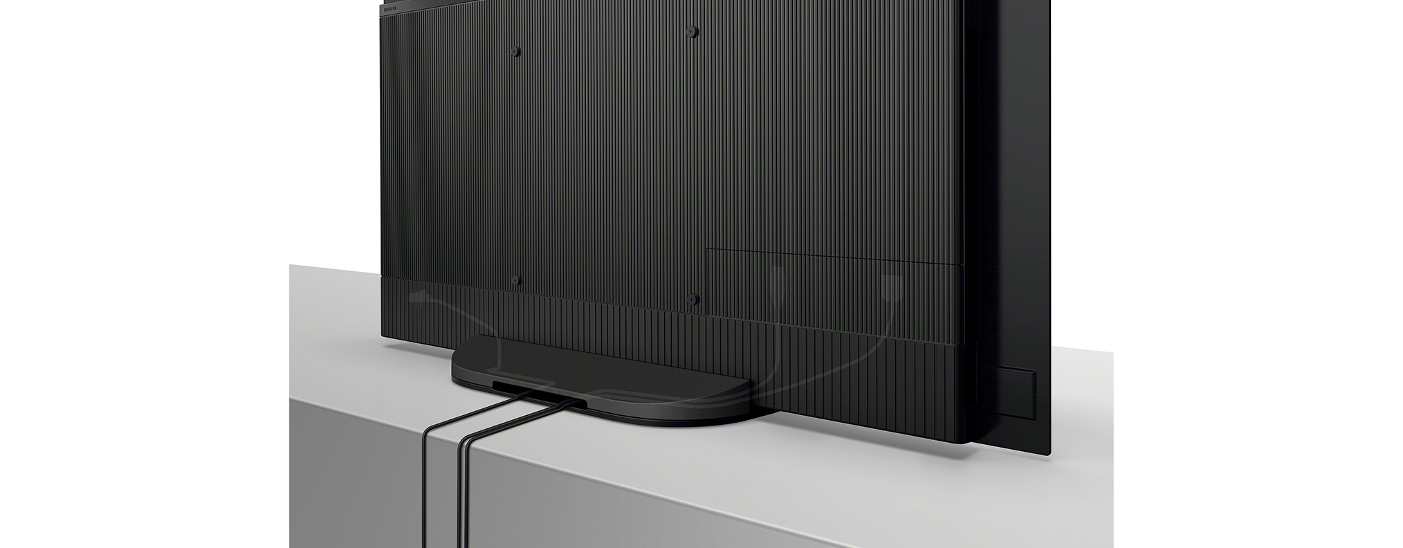 Egy fekete Nespresso gép egy csésze eszpresszóval és tejhabosítóval.