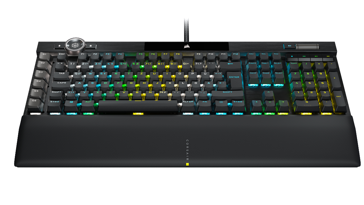 Schwarze mechanische Tastatur mit beleuchteten Tasten und Handgelenkauflage vor weißem Hintergrund.