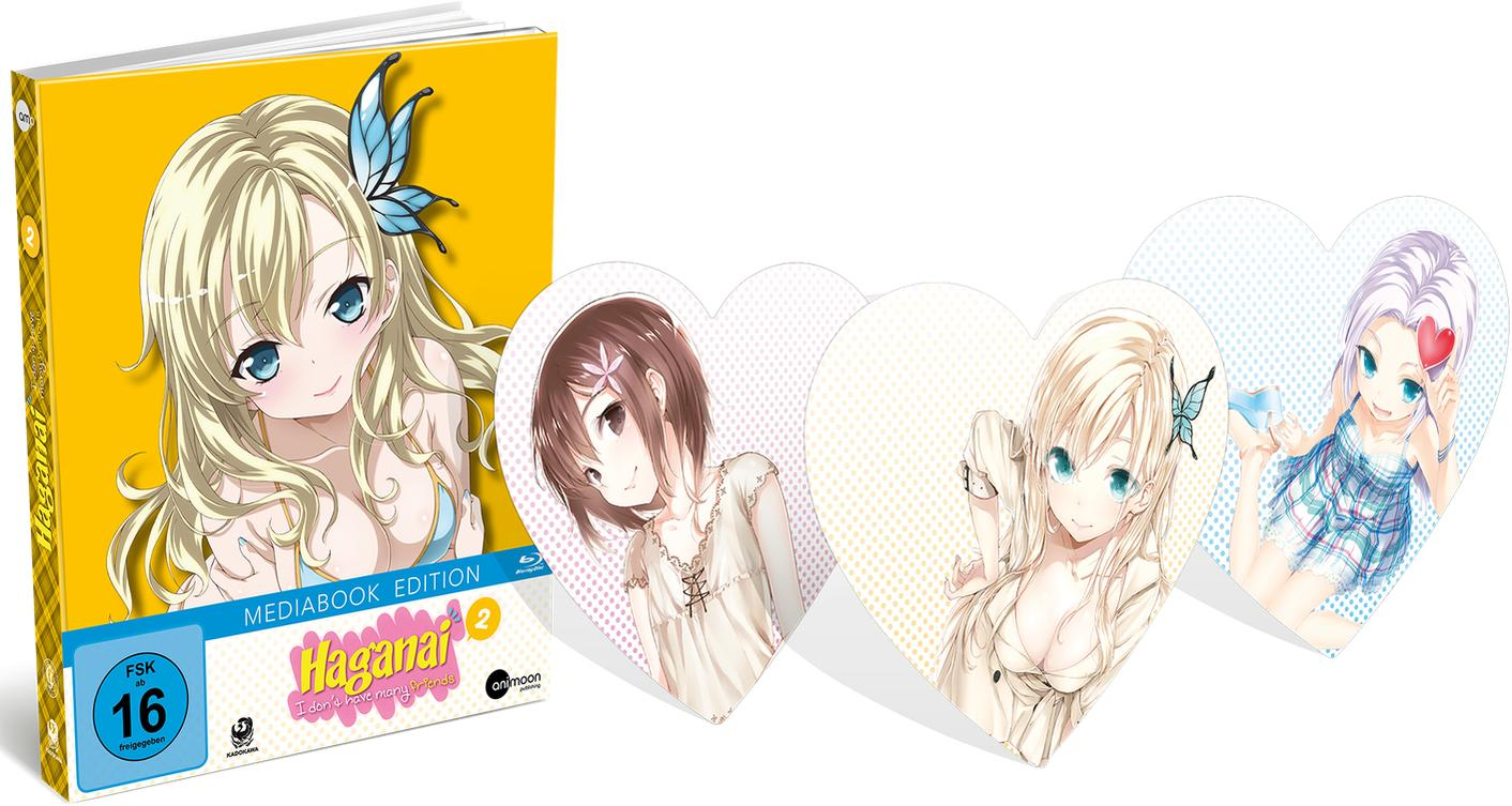 Ein Mediabook mit Anime-Charakteren auf dem Cover und herzförmigen Karten mit Anime-Mädchen darauf.