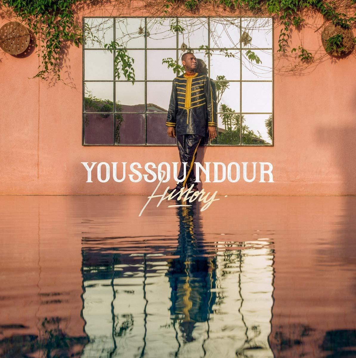 Album cover: Youssou Ndour 'History' with a man standing near a window.