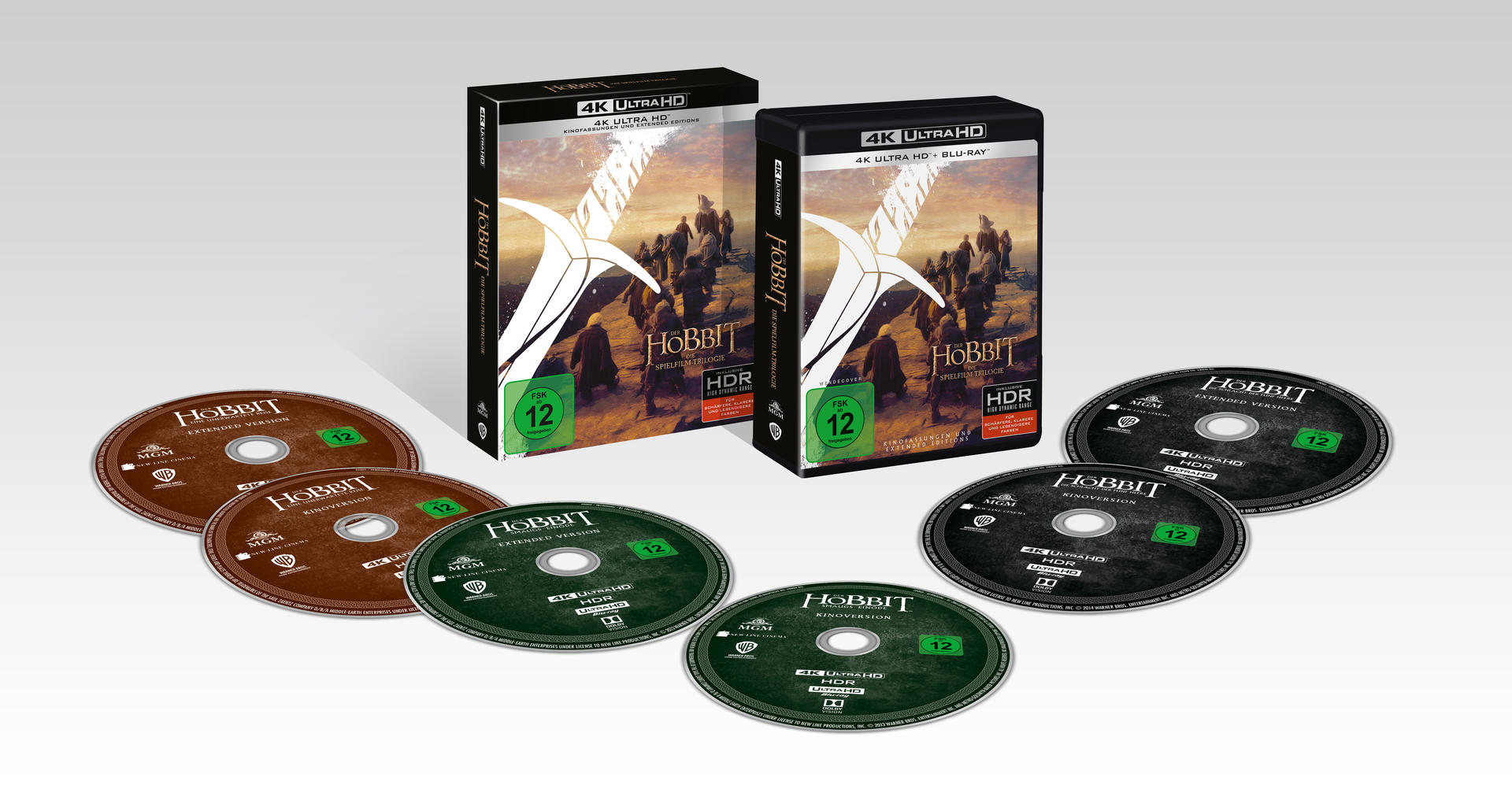 The Hobbit Blu-ray-Set. Zwei Hüllen und Discs, mit Bildern eines Schwertes und Charakteren.