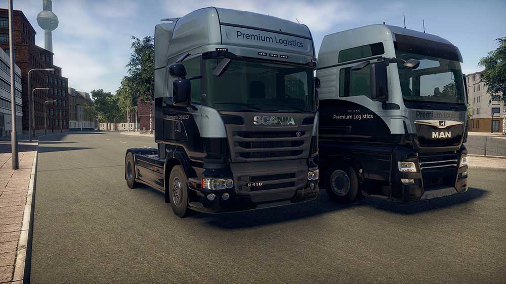 Deux camions Premium Logistics garés sur une route.