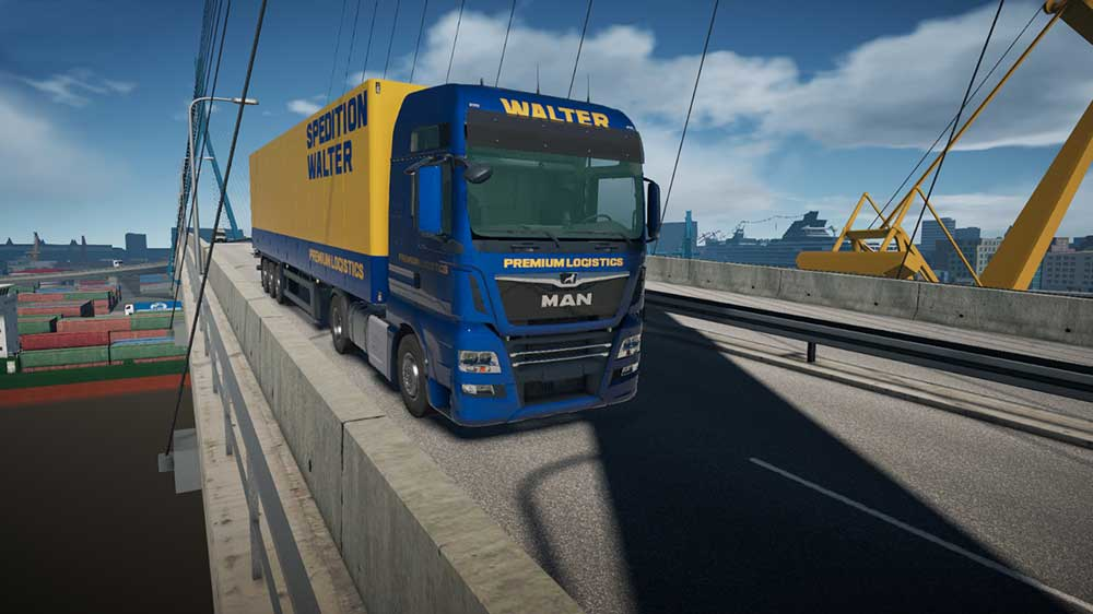 Un camion bleu et jaune sur un pont, avec une remorque jaune et le mot WALTER.