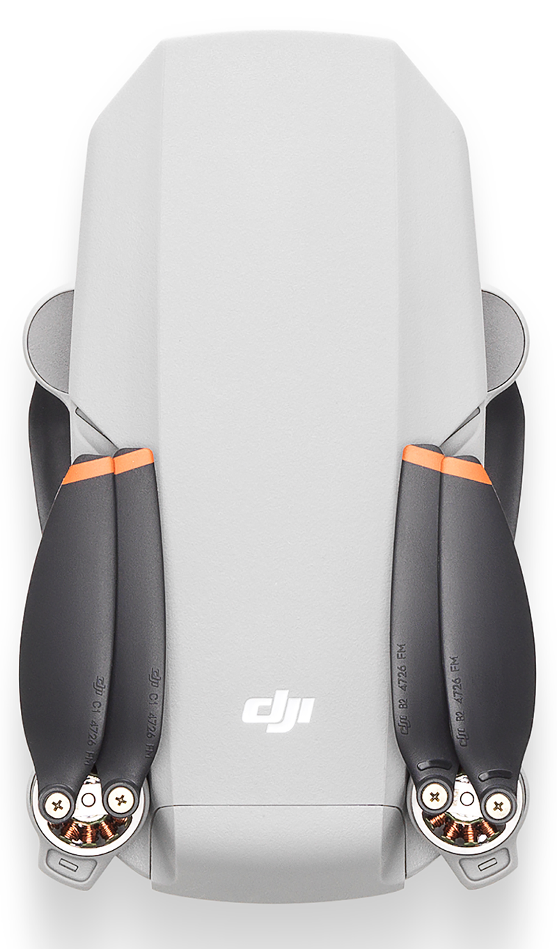 Een grijze en zwarte DJI Mini drone, met de bovenkant en uitgevouwen propellers.
