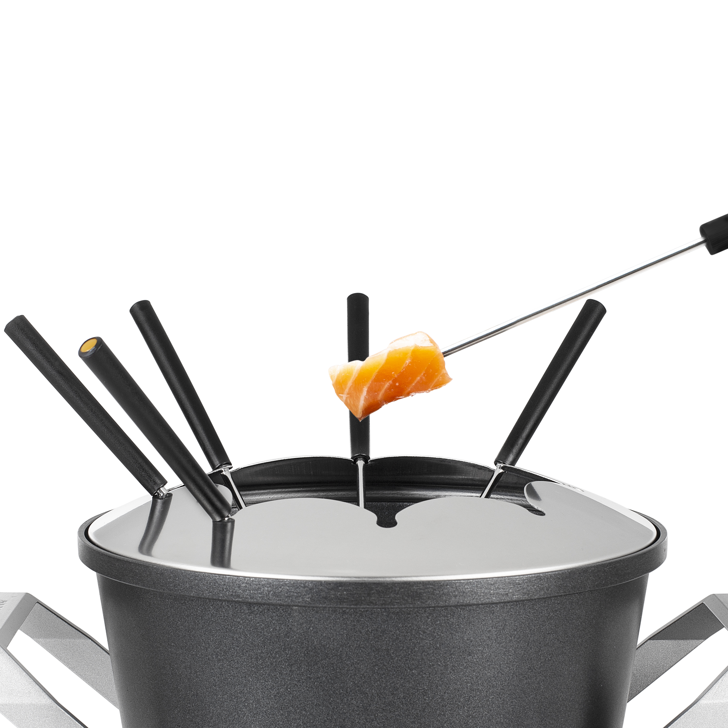 Close-up of a fondue pot with forks, one with a piece of food.
