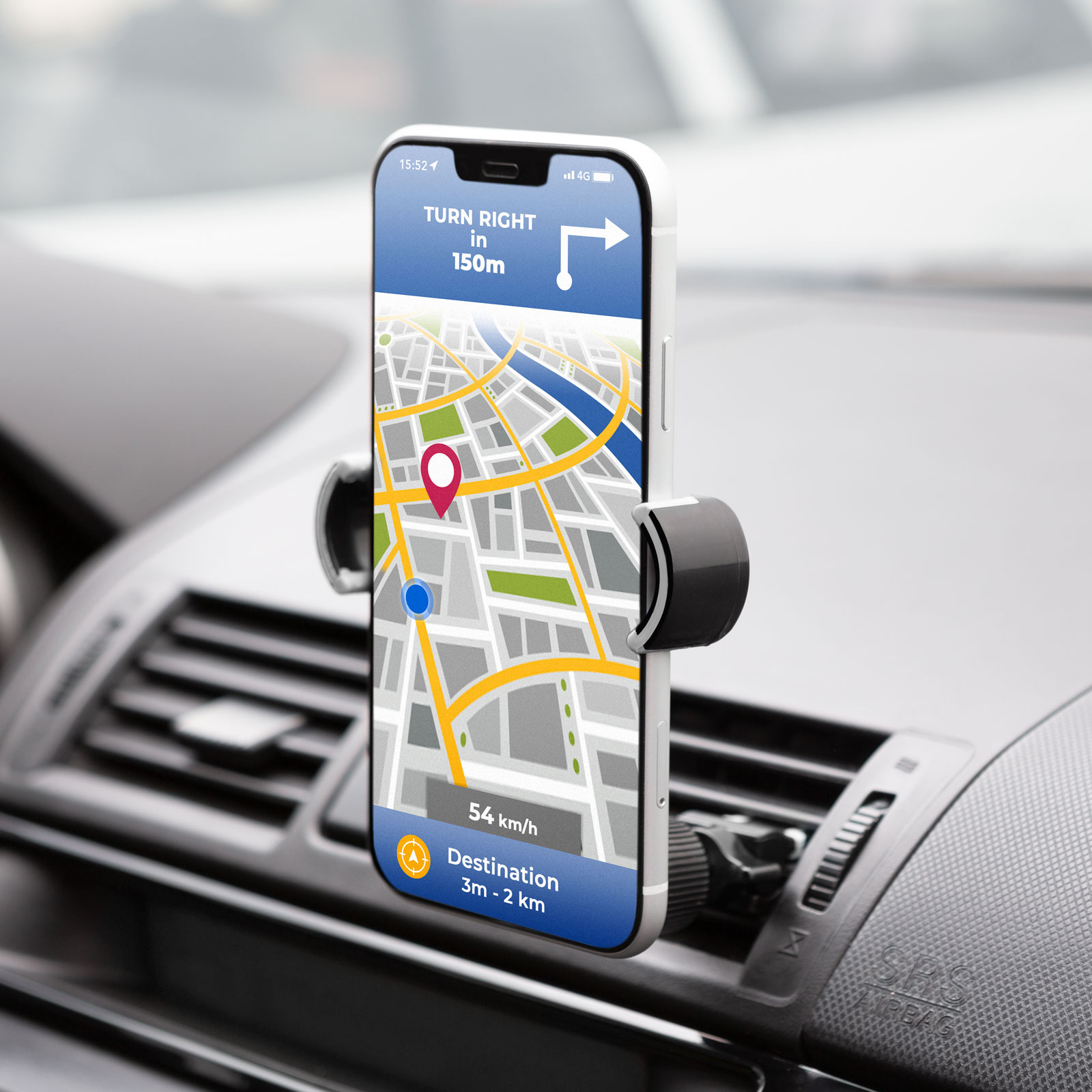 Egy telefon egy autós tartóban GPS térképet mutat navigációval.