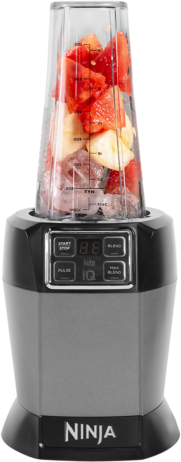 Ninja blender with fruits and ice inside, black and grey base.