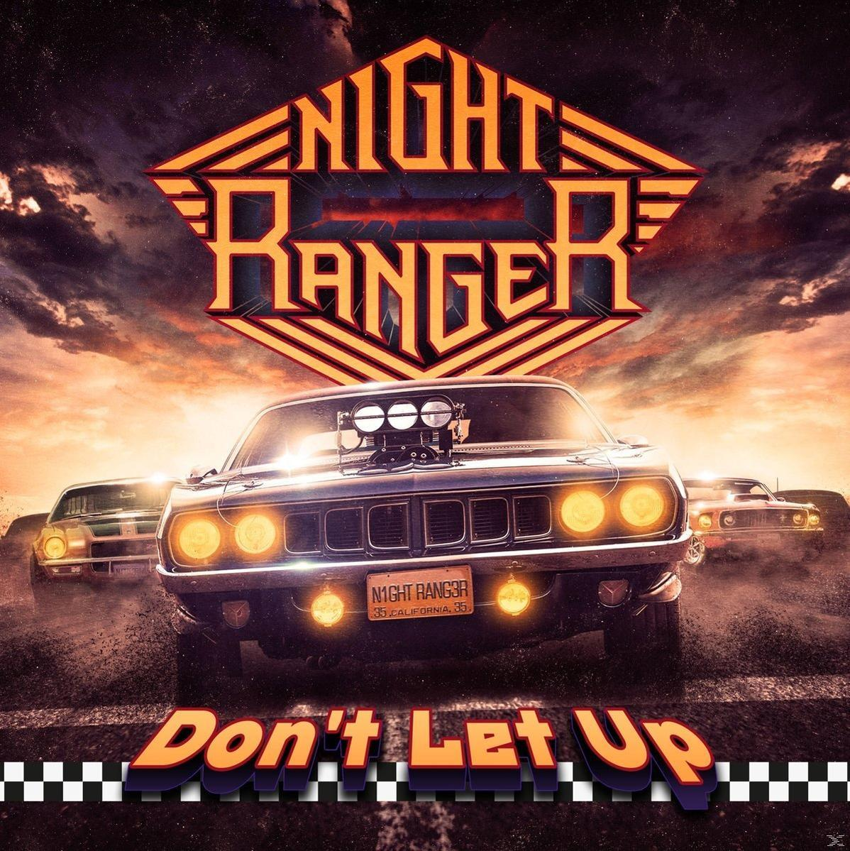 A Night Ranger album borítója. Egy sötét autó, fényes fényszórókkal előre száguld, a "Don't Let Up" szöveg és egy logó.