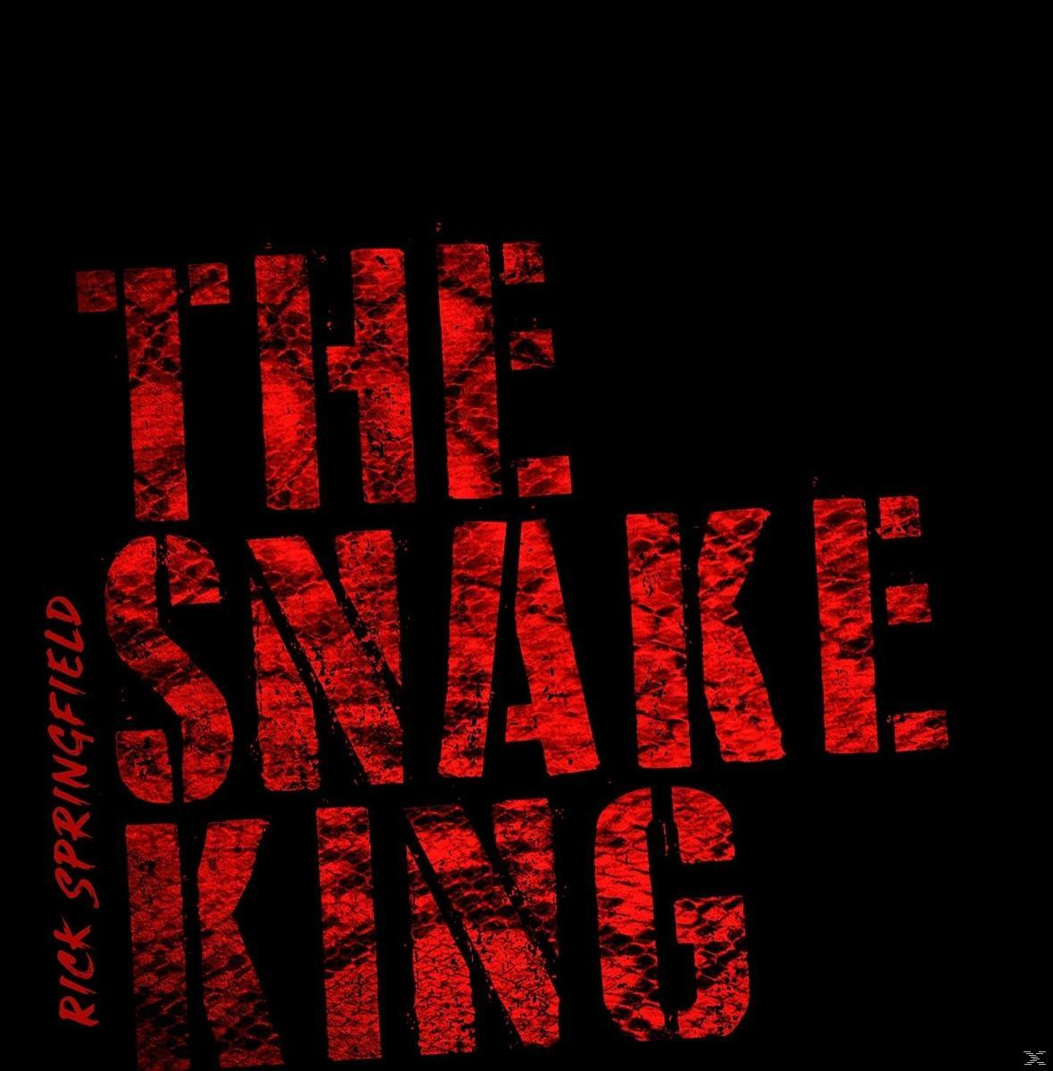 Text auf schwarzem Hintergrund: 'THE SNAKE KING' in roter, strukturierter Schrift und 'RICK SPRINGFIELD'.