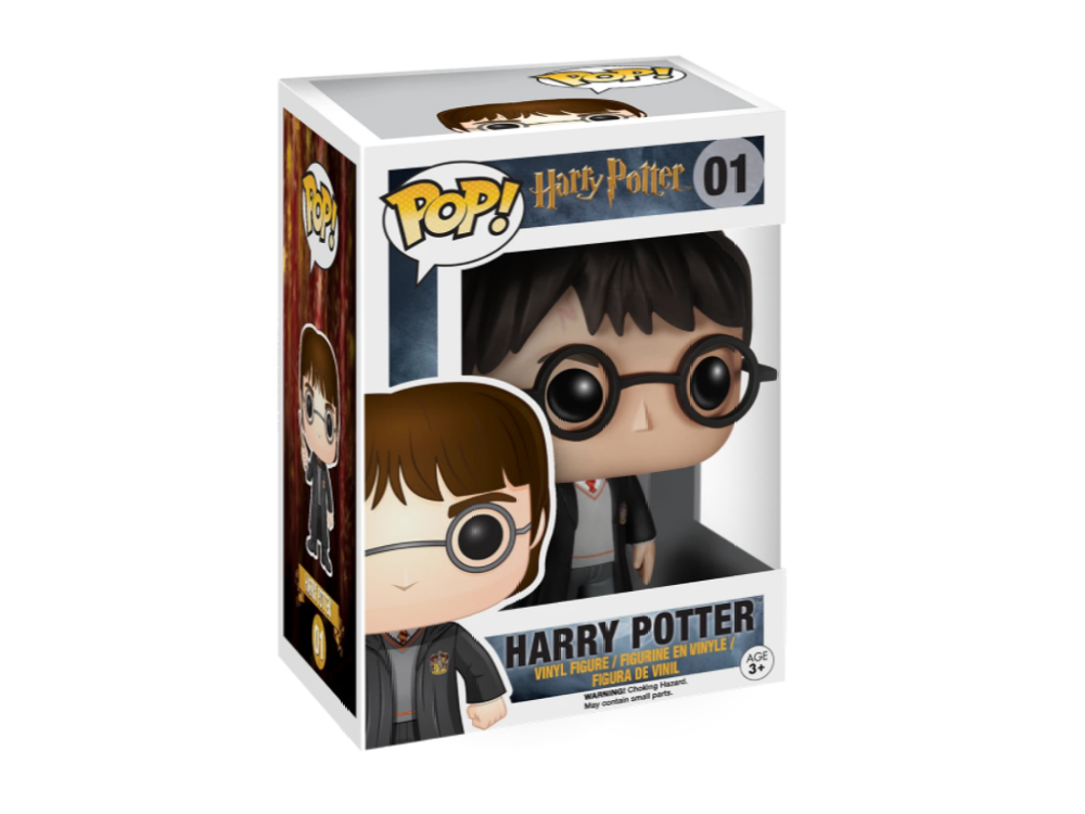Figura de Harry Potter en caja. La figura está en una caja con imágenes de Harry Potter.