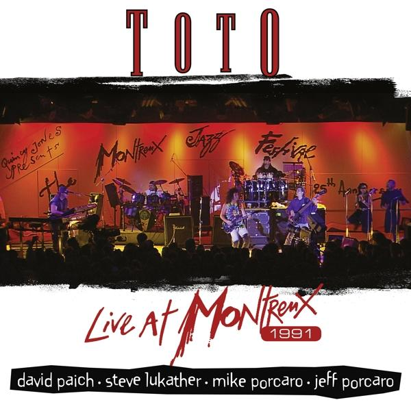A Toto együttes élő albumának borítója, a színpadon játszanak, piros háttérrel.