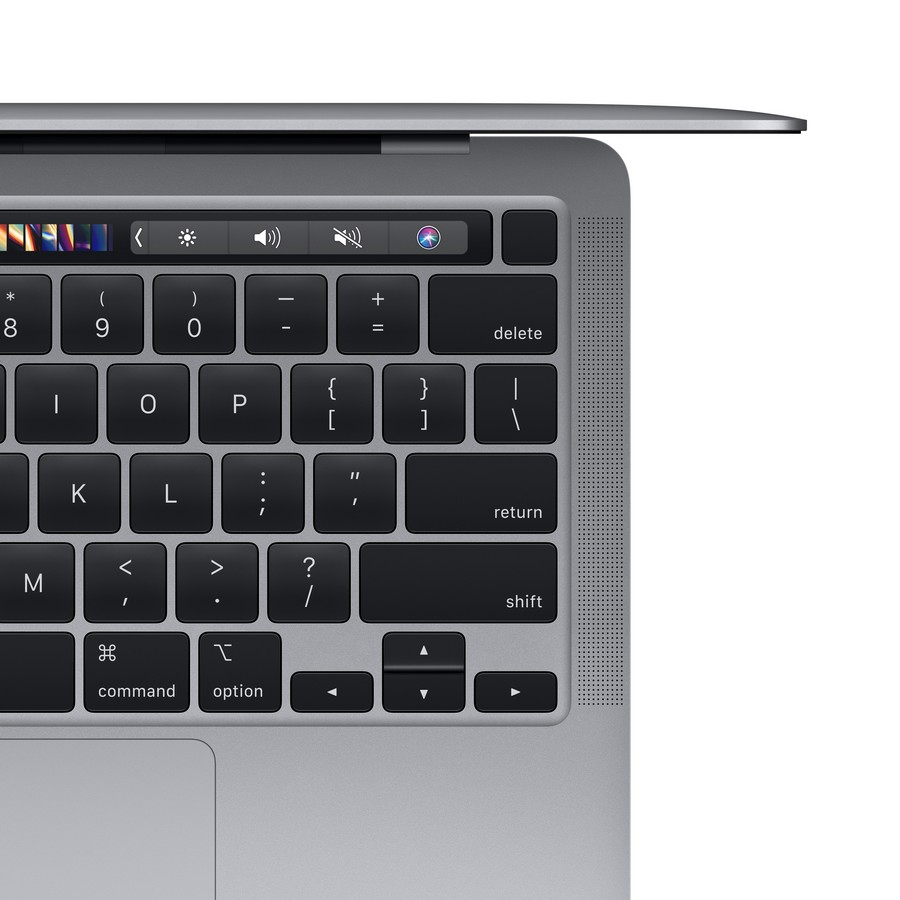 Primer plano del teclado de un MacBook. Teclas negras, marco plateado y Touch Bar.