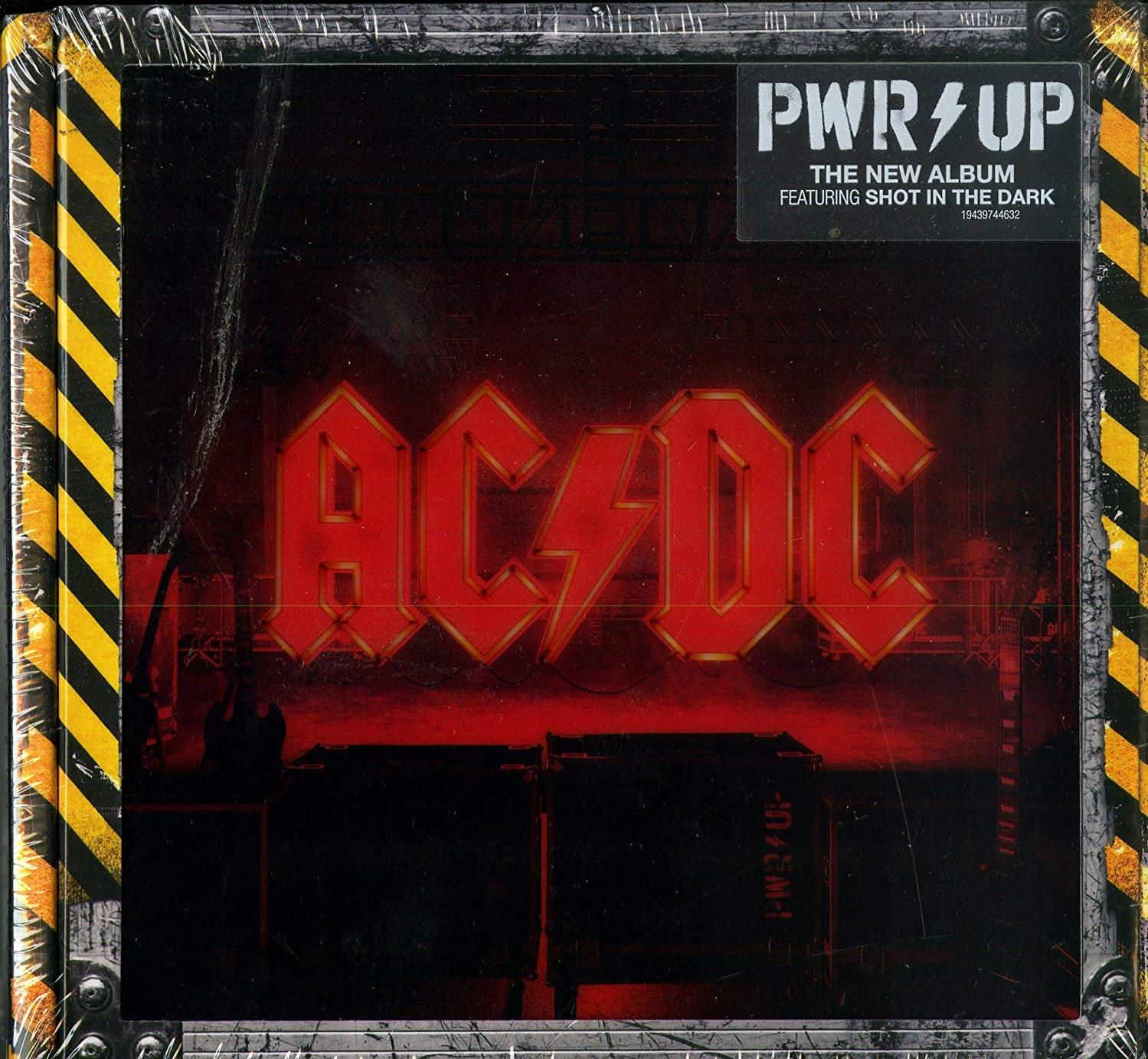 Albumhoes voor AC/DC's PWR/UP. Het logo is rood en verlicht. De achtergrond is industrieel.