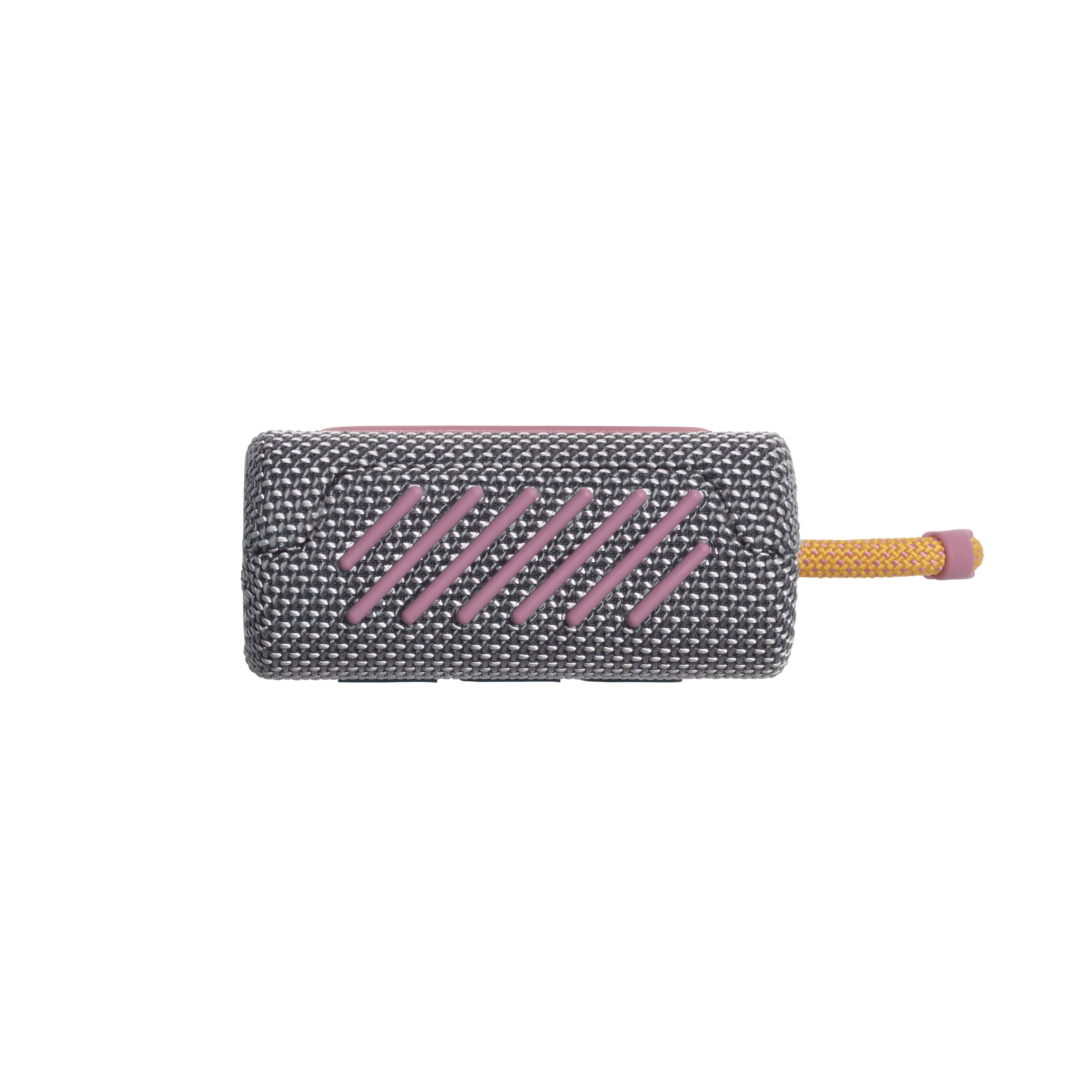 Draufsicht eines grau-rosa tragbaren Lautsprechers mit gelbem Band. Mesh-Design.