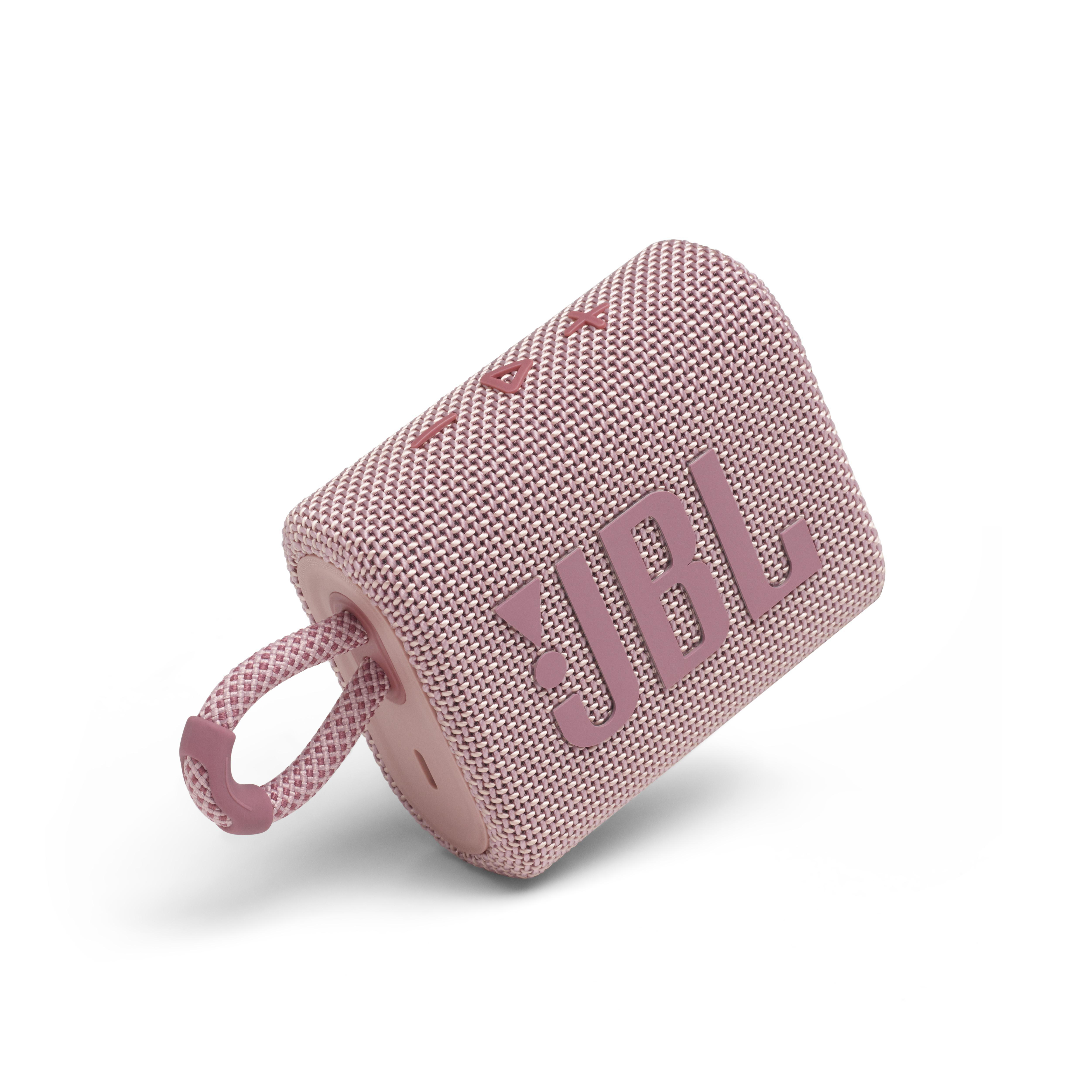 Ein rosa JBL-Lautsprecher auf weißem Hintergrund mit einem Griff. Der Markenname JBL ist sichtbar.