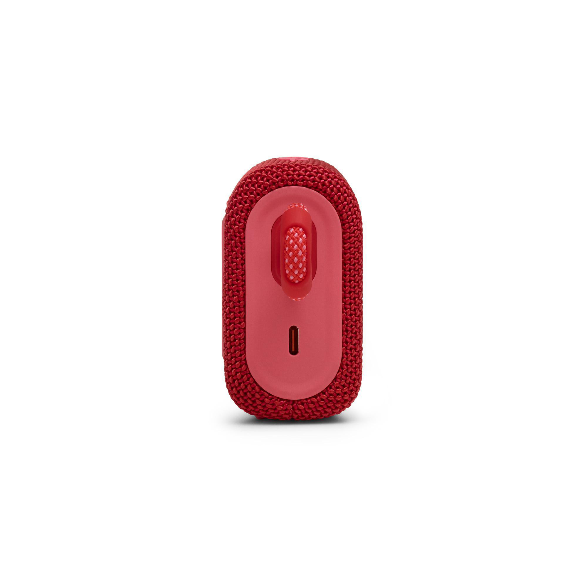 Ein roter, rechteckiger Lautsprecher mit roter Schlaufe oben.