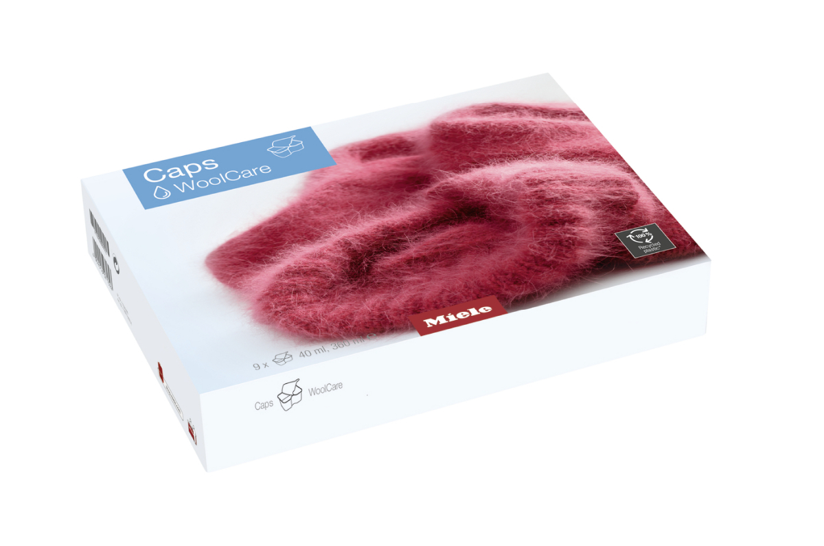 A white box with a picture of pink, fluffy wool caps and the word 'Caps'.