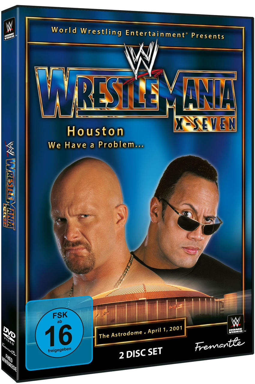 DVD-Cover mit den Gesichtern zweier Männer, einem Stadion und dem Text 'Wrestlemania X-Seven'. Blaues und goldenes Design.