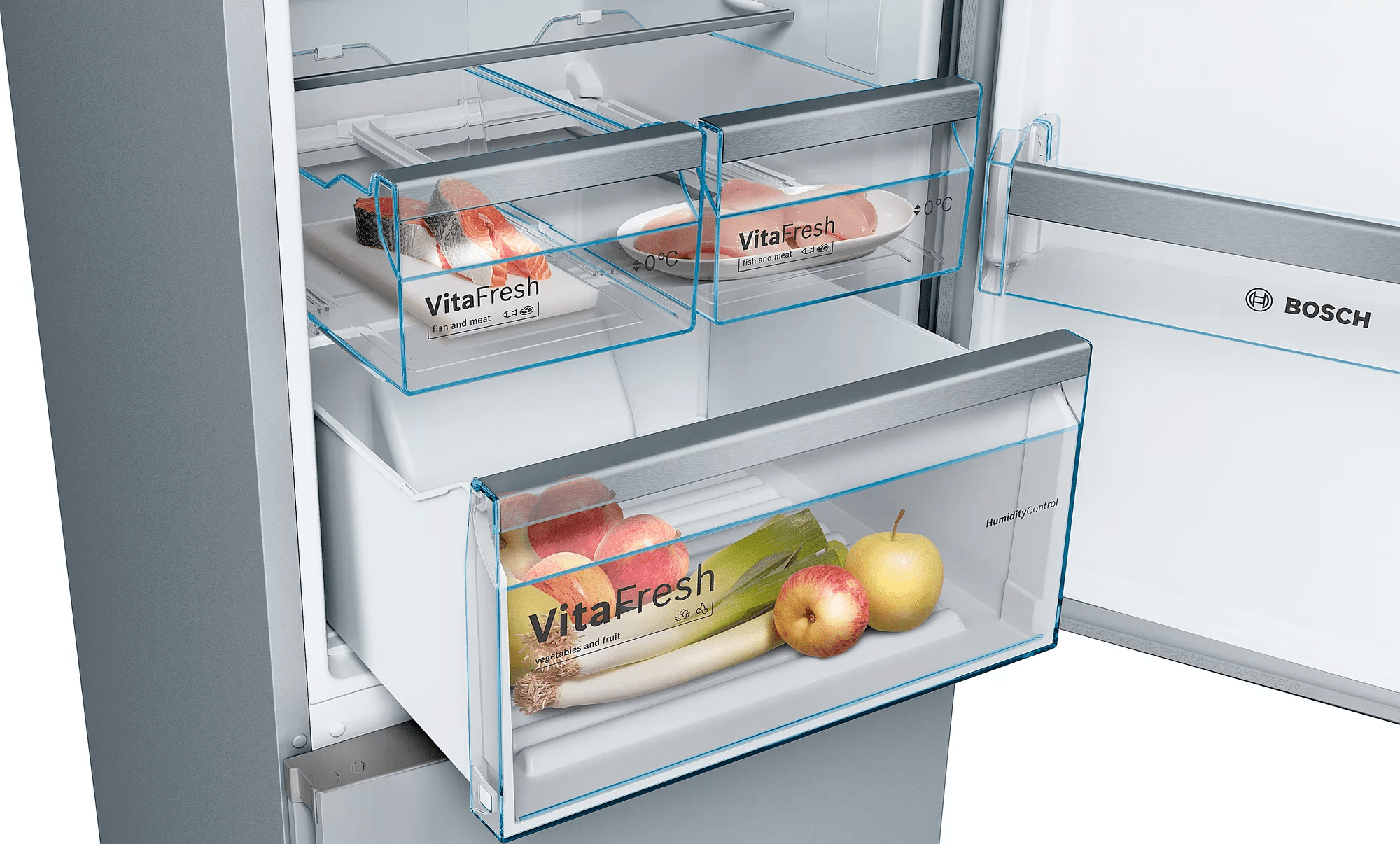 Interior del refrigerador con cajones abiertos. Frutas y verduras se almacenan en los cajones VitaFresh.