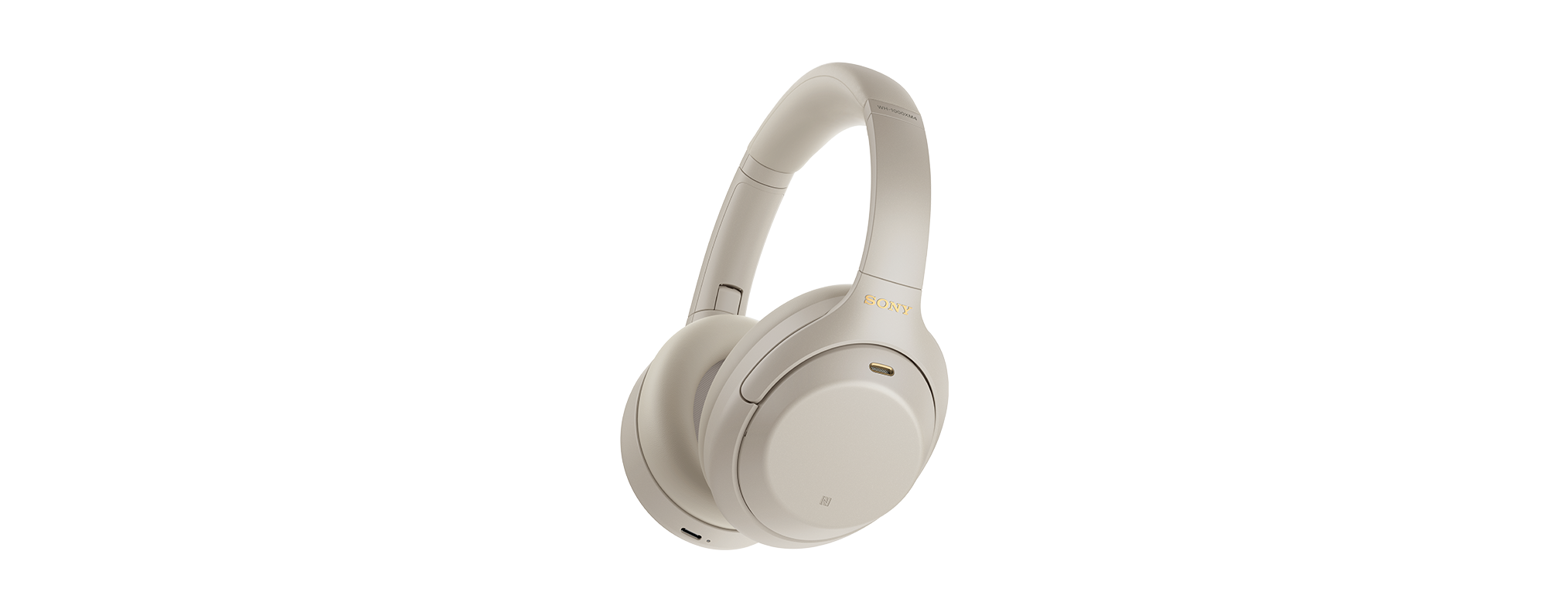 Beige Kopfhörer auf schwarzem Hintergrund. Die Kopfhörer sind modern und haben ein minimalistisches Design.