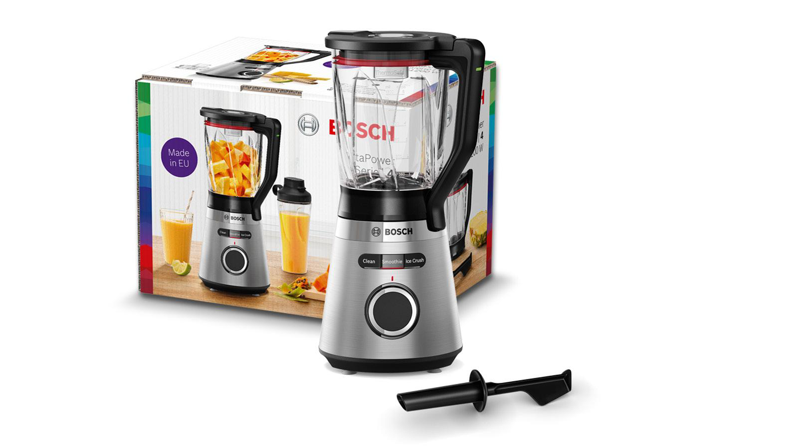 Silver and black Bosch blender with box. Blender on the left. Fruits visible. White background.