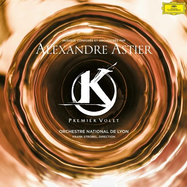 Pochette d'album avec les mots 'Alexandre Astier'. Elle a une palette de couleurs or et marron.