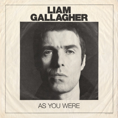 Pochette de l'album de Liam Gallagher avec un gros plan de son visage sur fond blanc.