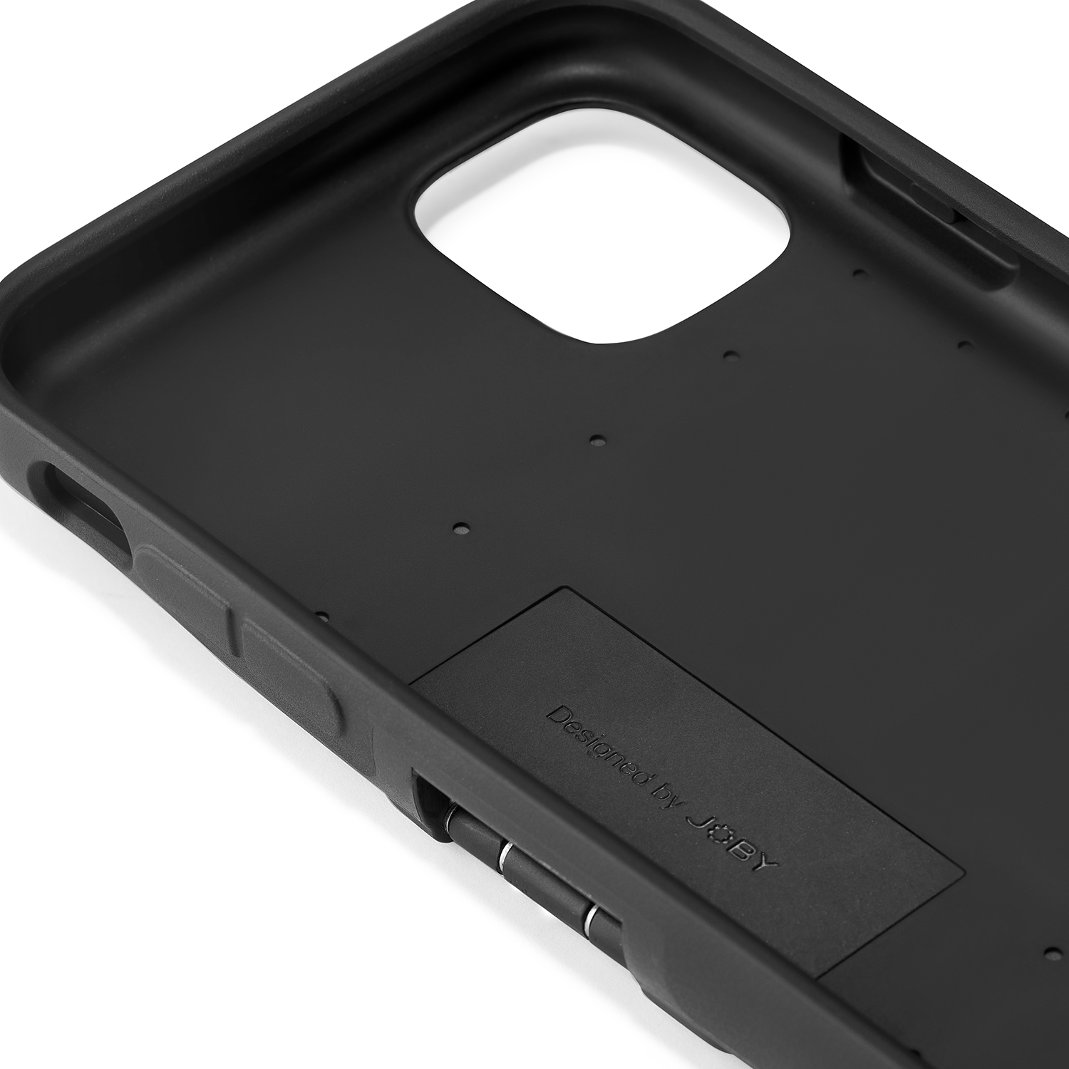 Black phone case interior, with space for the phone and a small compartment.