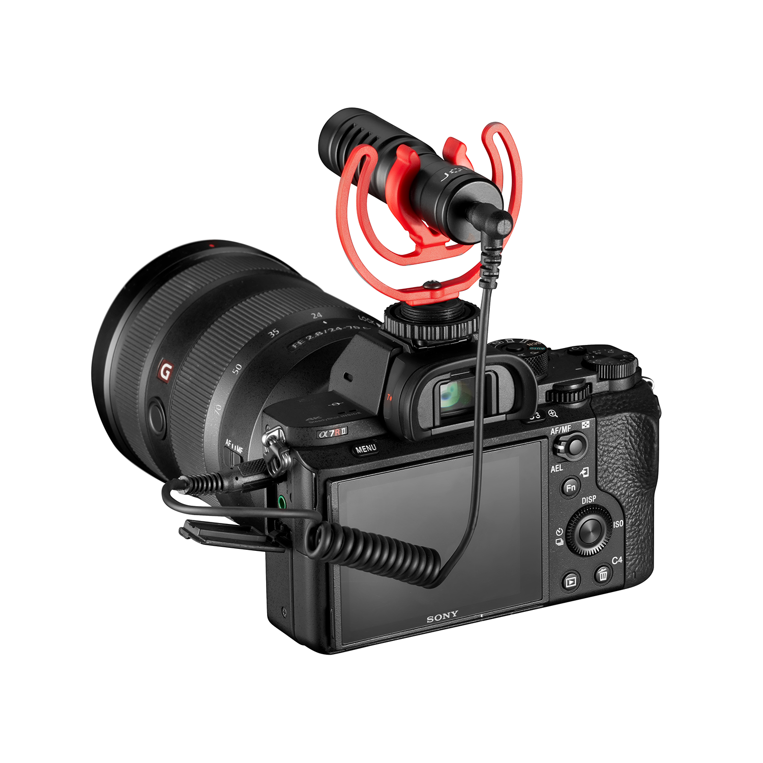 A black camera with a lens and a red microphone attached on a white background.