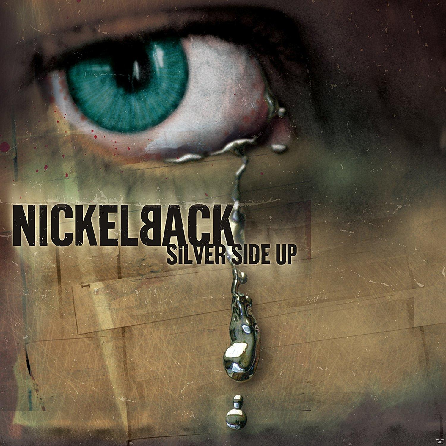Album borító: egy szem közelképe, egy lezuhanó könnyel. A szöveg Nickelback Silver Side Up.