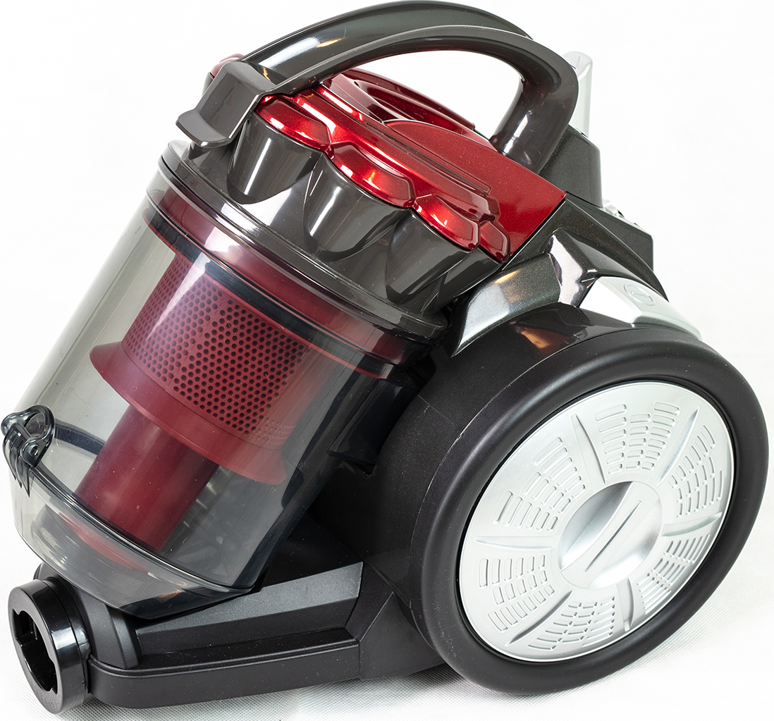 Un aspirateur noir et rouge avec un récipient à poussière transparent.