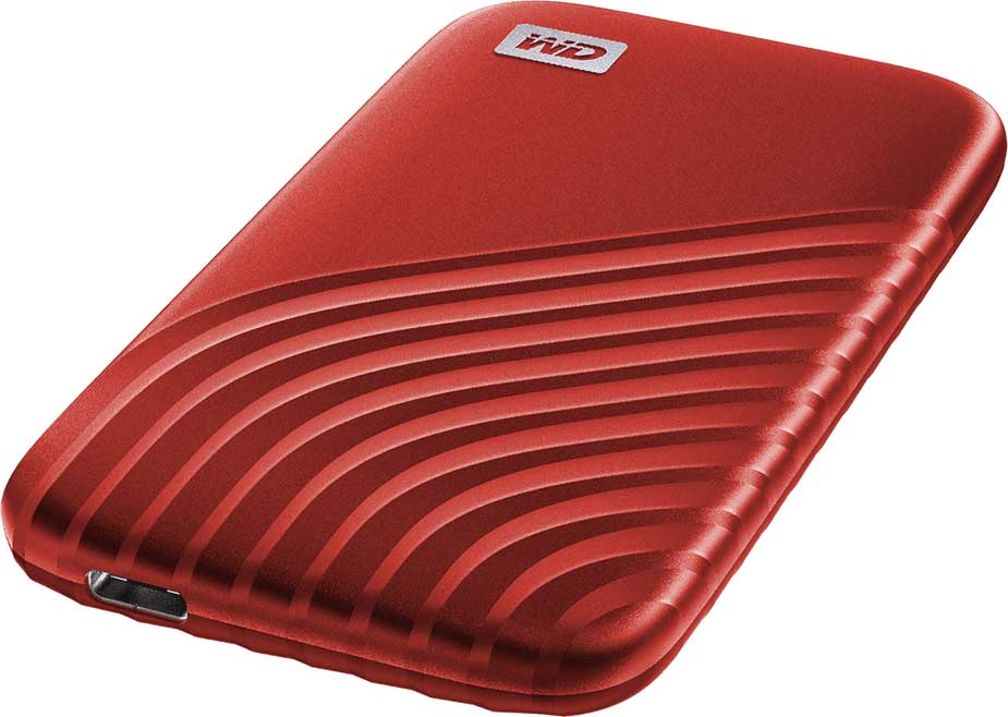 Red external hard drive with a textured design. The drive is on a white surface.