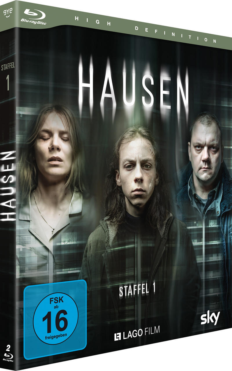 Hausen Staffel 1 Blu-ray-Cover mit drei Personen vor dunklem Hintergrund.