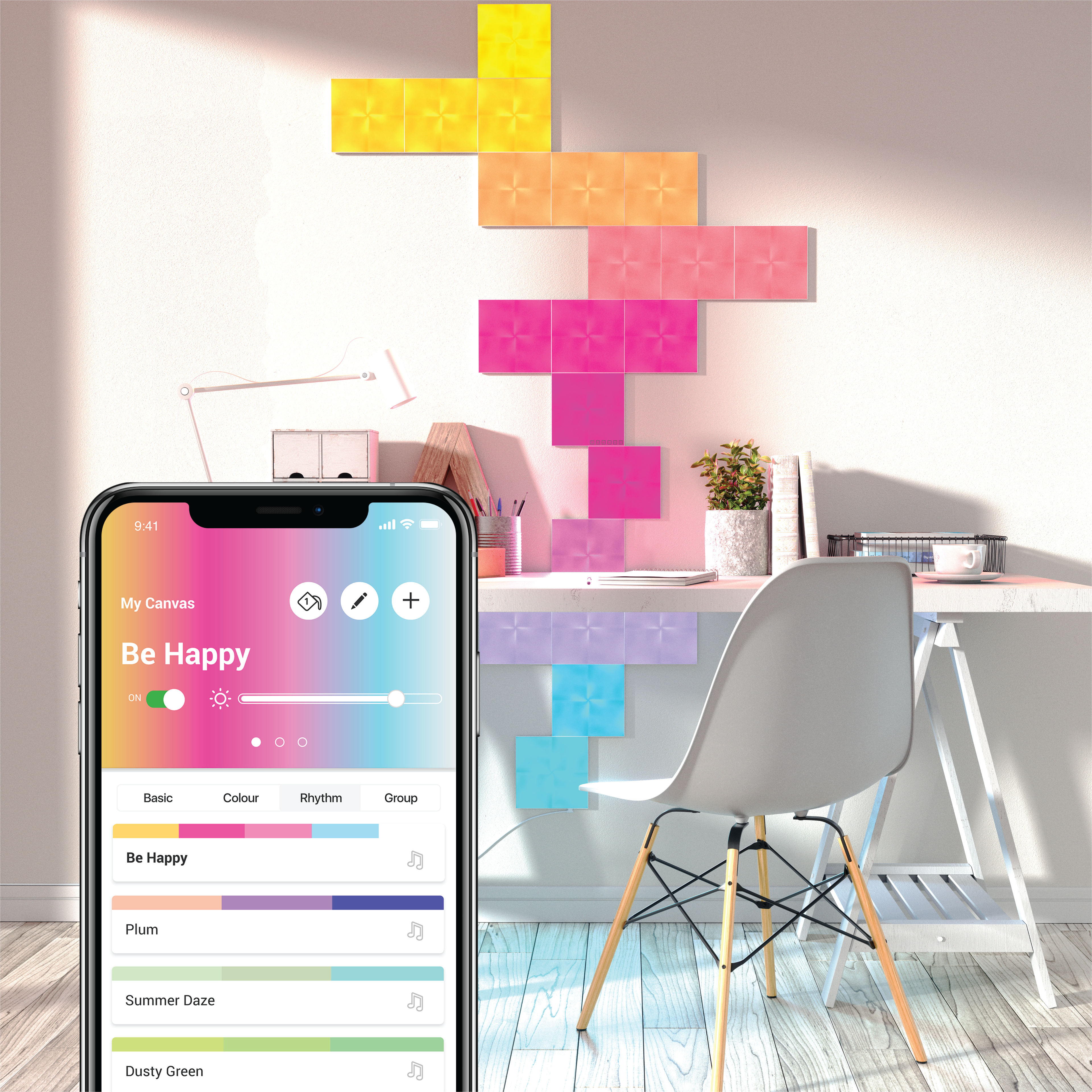 Ein Schreibtisch mit einem Telefon, das eine farbenfrohe App anzeigt, und eine Wand mit farbenfrohen Paneelen.