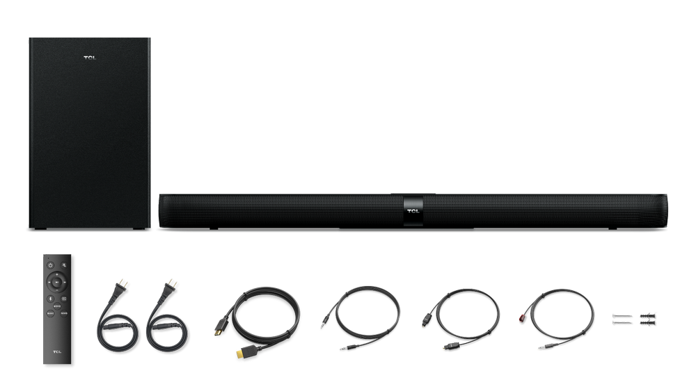 Barra de sonido negra con subwoofer, mando a distancia y cables. El fondo es negro.