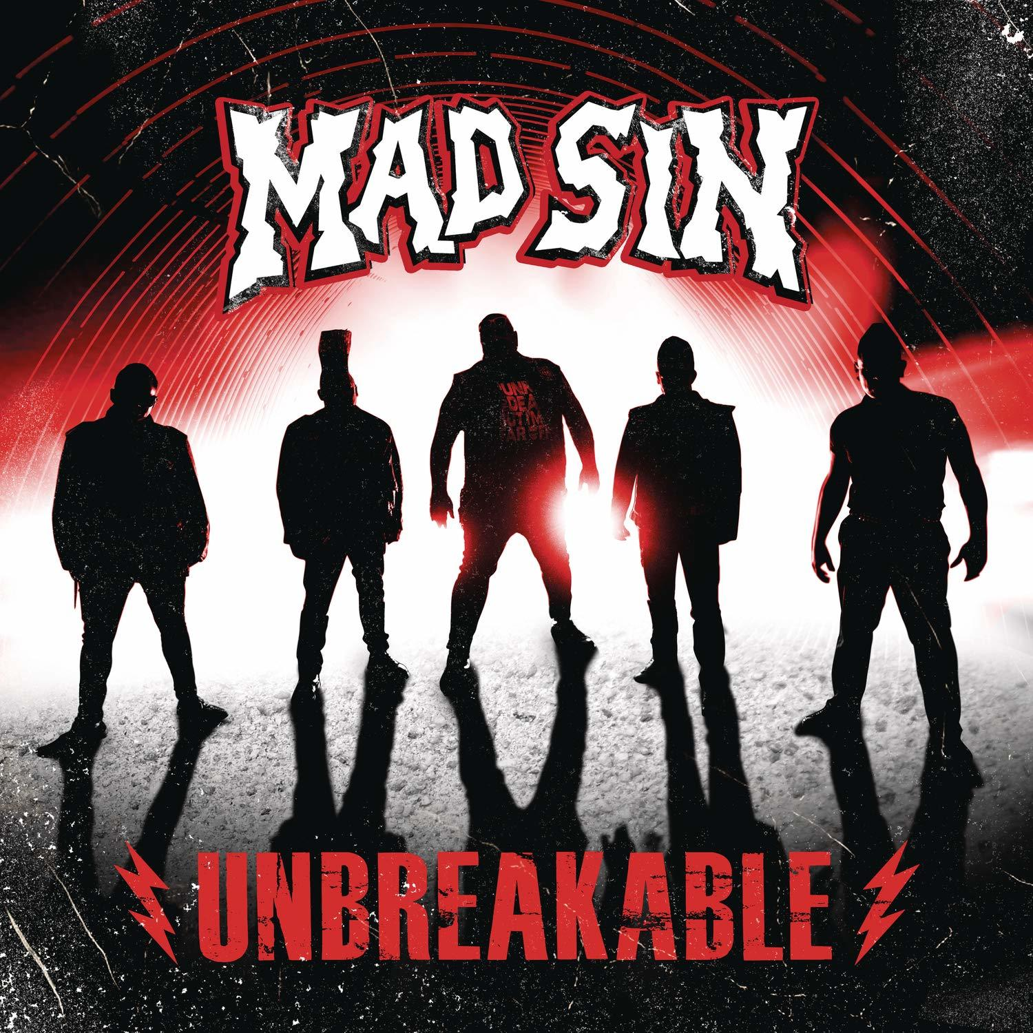 Albumcover mit fünf Schattenfiguren und dem Wort 'Unbreakable'.
